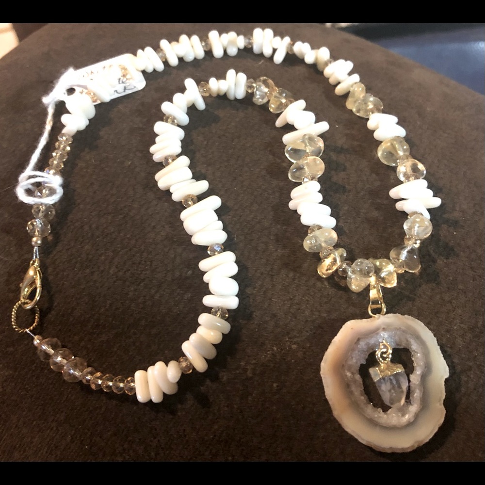 Sliced geode pendant with crystal drop and coral.